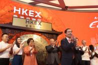 Daniel Zhang, Laura Cha and Tung Chee-hwa attend Alibaba Group's listing ceremony at the Hong Kong Stock Exchange (HKEX) in Hong Kong