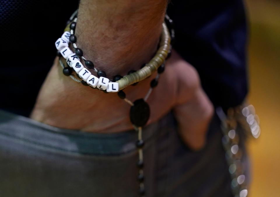Jan. 25, 2023; Columbus, Ohio, USA; Jerred Mcpherson, 24, wears a bracelet that reads, "Walk Tall," along with a rosary at Broad Street Methodist Church where a warming center was operated by the Columbus Coalition for the Homeless. The Community Shelter Board was conducting its annual homeless count. Mandatory Credit: Barbara J. Perenic/Columbus Dispatch