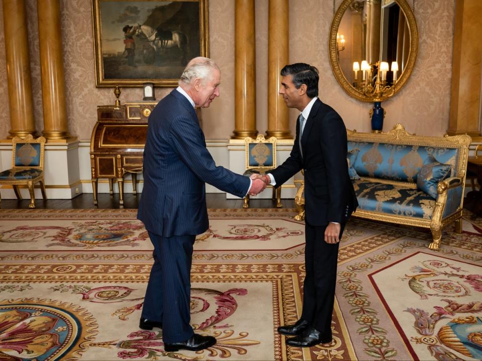 King Charles welcoming Rishi Sunak during an audience at Buckingham Palace (PA)