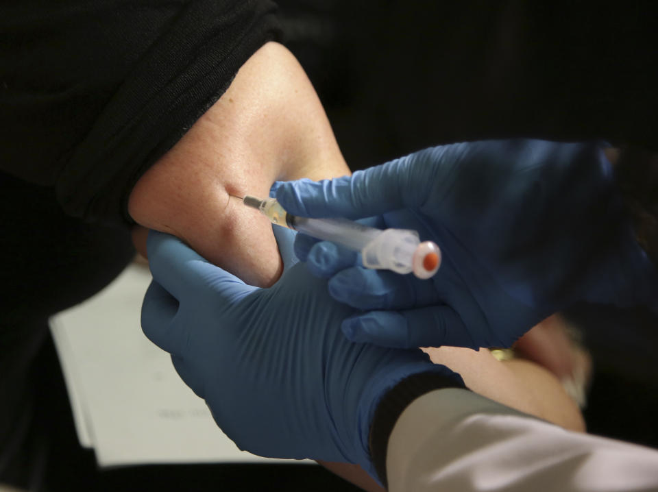 FILE - In this March 27, 2019, file photo, a woman receives a measles, mumps and rubella vaccine at the Rockland County Health Department in Pomona, N.Y. Measles cases in the U.S. this year have climbed to the highest level in 25 years, according to preliminary figures, a resurgence attributed largely to misinformation about vaccines. (AP Photo/Seth Wenig, File)