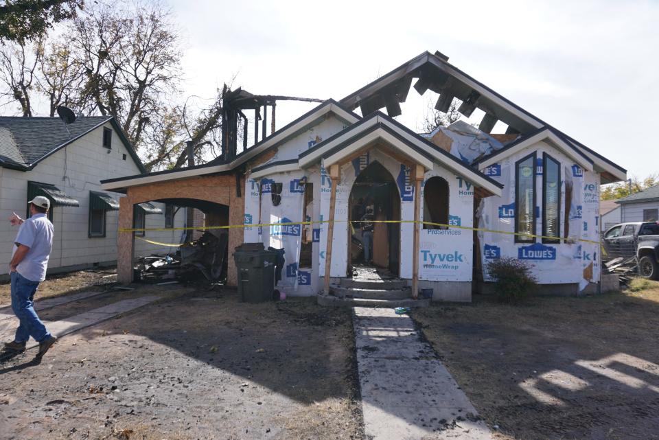 A Carlsbad home caught fire on Thanksgiving. The following day homeowners Sherry and Patrick Ellis attempted to clean and salvage what they could on Nov. 26.