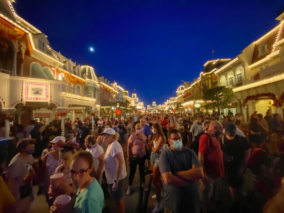 Crowds gather to watch fireworks at Magic Kingdom in August 2021.