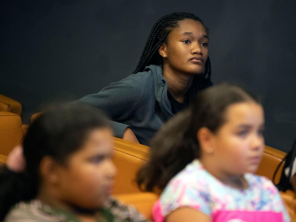 Riana Russell listens to UScellular engineer Joey Chandler talk about cellular technology and STEM at the Boys & Girls  Club's Regal Teen Center in Knoxville, Tenn. on Monday, July 11, 2022. 