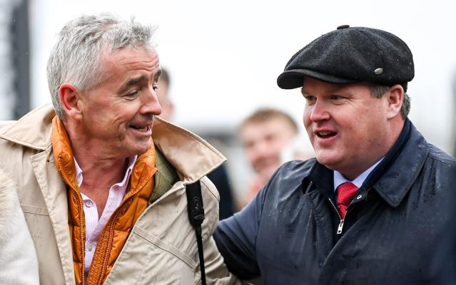Owner Michael O'Leary and trainer Gordon Elliott, right, after winning the Glenfarclas Cross Country Chase with Delta Work on day two - Getty/Harry Murphy