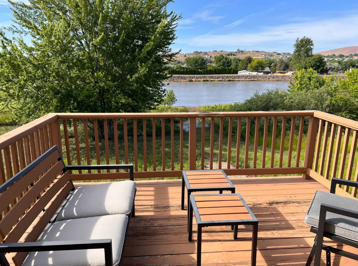 Deck attached to master bedroom of the “Spectacular Waterfront Farmhouse” Courtesy: Spectacular Waterfront Farmhouse AirBNB