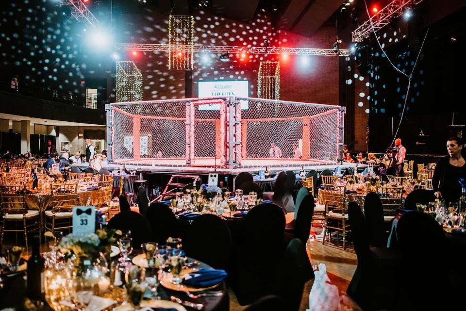 Tables surround the MMA boxing ring at the 2019 Black Tie and Boxing charity event. This year's event will be Saturday.