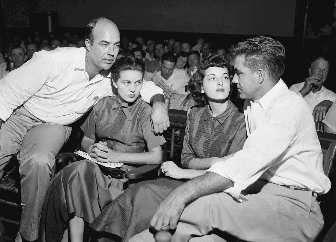 In this Sept. 23, 1955, file photo, J.W. Milam, left, his wife, second from left, Roy Bryant, far right, and his wife, Carolyn Bryant, sit together in a courtroom in Sumner, Miss. Bryant and his half-brother Milam were charged with murder but acquitted in the kidnapping and torture slaying of 14-year-old black teen Emmett Till in 1955 after he allegedly whistled at Carolyn Bryant. A team searching the basement of a Mississippi courthouse for evidence about the lynching of Black teenager Emmett Till has found the unserved warrant in June 2022 charging a white woman in his kidnapping in 1955, and relatives of the victim want authorities to finally arrest her nearly 70 years later.