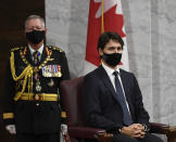 Chief of Defence Staff Jonathan Vance, left, and Canadian Prime Minister Justin Trudeau listen to Gov. Gen. Julie Payette deliver the throne speech in the Senate chamber in Ottawa, Ontario, on Wednesday, Sept. 23, 2020. (Adrian Wyld/The Canadian Press via AP)