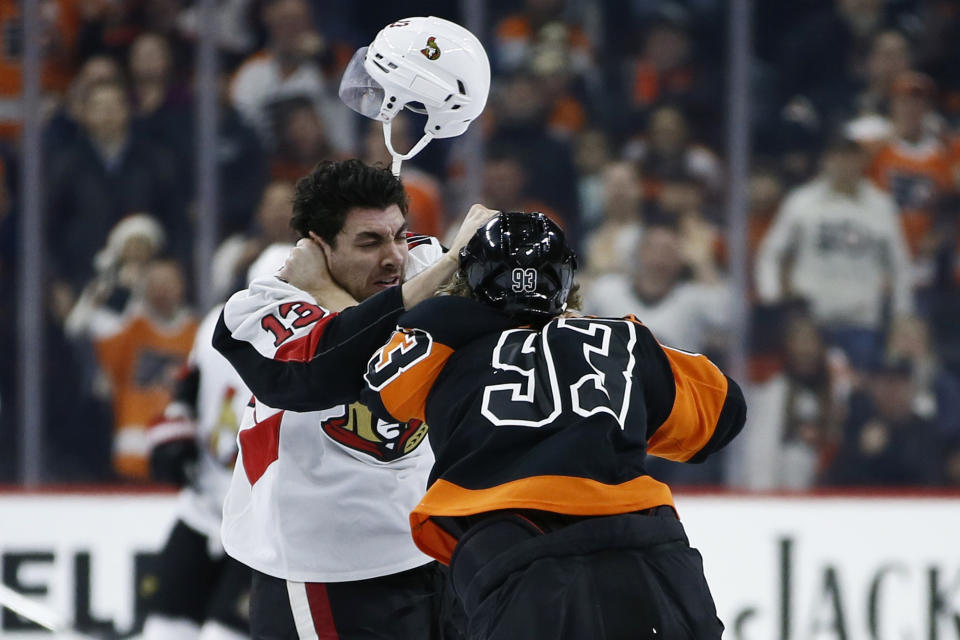 Ottawa Senators' Nick Paul, left, and Philadelphia Flyers' Jakub Voracek fight during the first period of an NHL hockey game, Saturday, Dec. 7, 2019, in Philadelphia. (AP Photo/Matt Slocum)