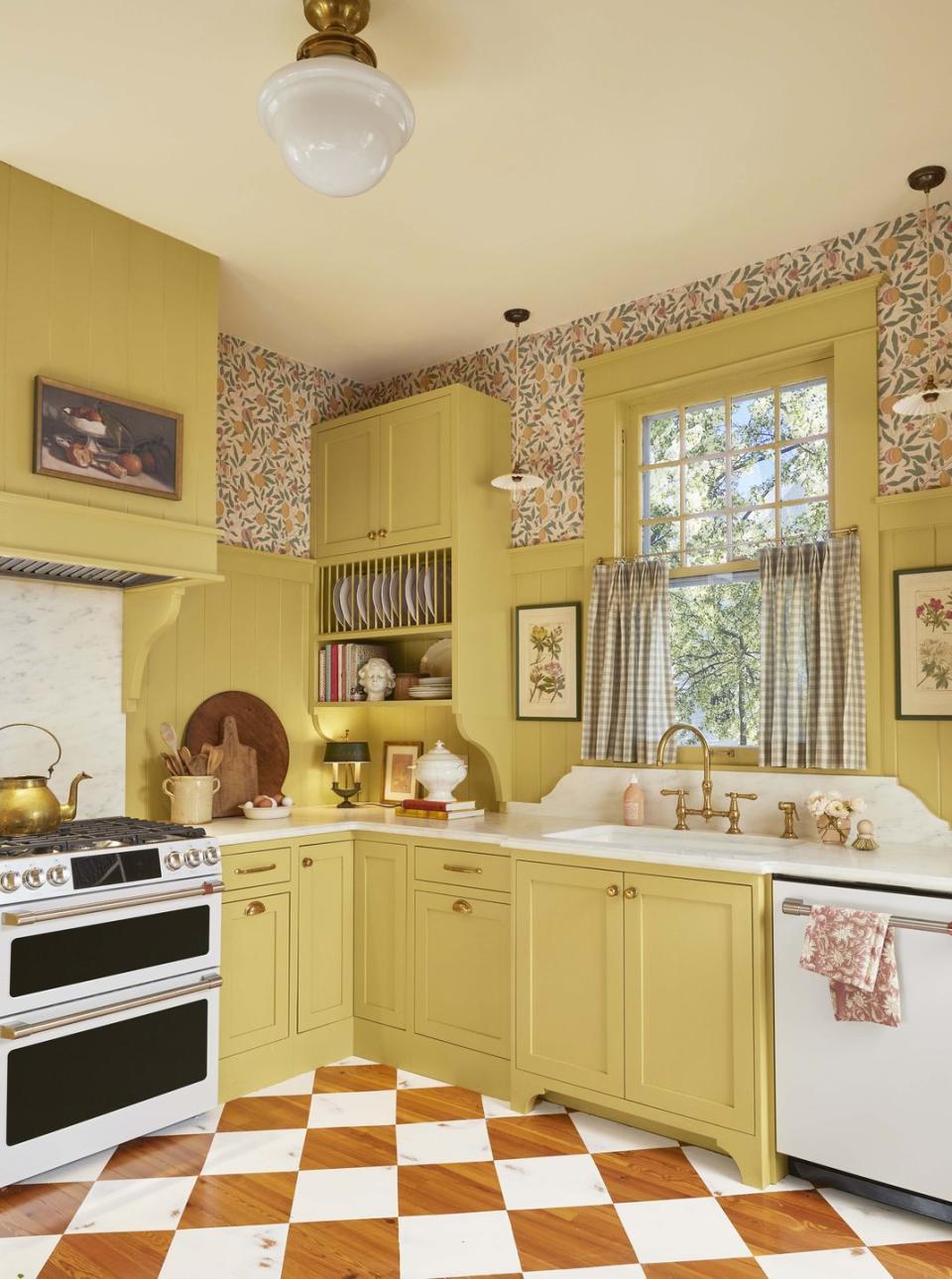 yellow british style kitchen with white and wood tone checkerboard floors