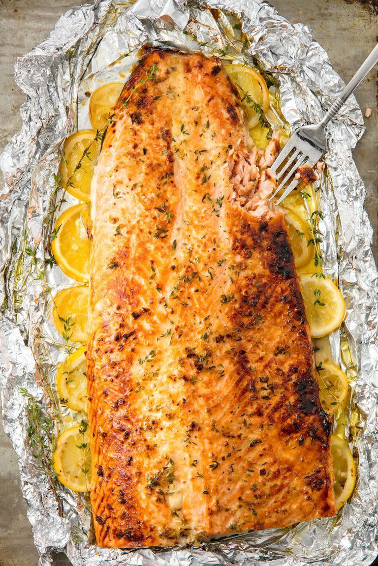 <p>This healthy baked salmon is the best way to feed a crowd. </p>Get the <a href="https://www.delish.com/uk/cooking/recipes/a28996578/best-baked-salmon-recipe/" rel="nofollow noopener" target="_blank" data-ylk="slk:Whole Baked Salmon;elm:context_link;itc:0;sec:content-canvas" class="link ">Whole Baked Salmon</a> recipe.