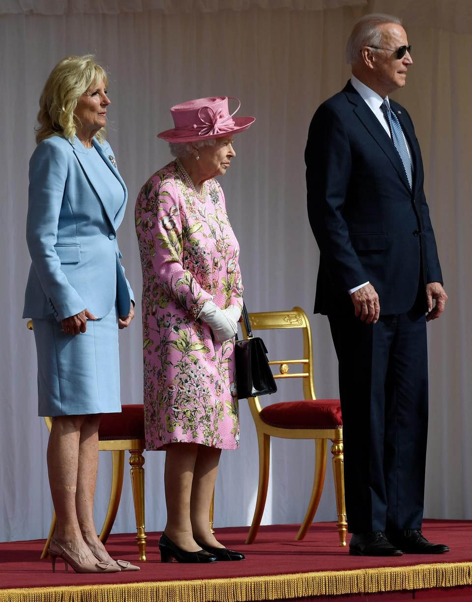 Britain's Queen Elizabeth II, center, stands with U.S. President Joe Biden and first lady Jill Biden at Windsor Castle near London on June 13, 2021.