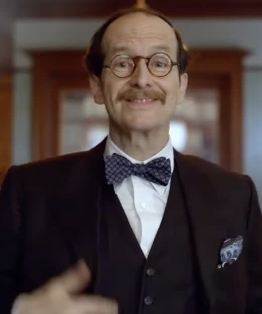 Denis O'Hare in American Horror Stories wearing a bow tie