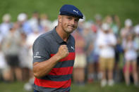 FILE- In this Aug. 29, 2021, file photo, Bryson DeChambeau reacts after sinking his putt on the 16th green during the final round of the BMW Championship golf tournament at Caves Valley Golf Club in Owings Mills, Md. When DeChambeau arrives at Whistling Straits for the Ryder Cup the 6-foot-1, 235-pound disrupter with a world-leading driving average of 323.7 yards, will bring with him an epic amount of baggage. He is in the middle of a months-long feud with one of his teammates, Brooks Koepka, who happens to have three more major titles than DeChambeau. (AP Photo/Nick Wass, File)