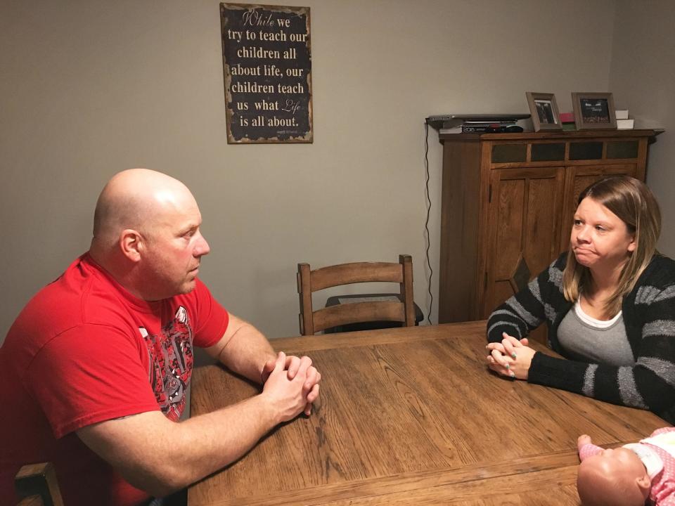 Tracy and Danielle Lammers, sitting in their dining room two weeks after learning Medi-Share&nbsp;considered&nbsp;Danielle's cancer a pre-existing condition and rejected payment for treatment. Medi-Share later reversed its decision, following their appeal. (Photo: Jonathan Cohn/HuffPost)