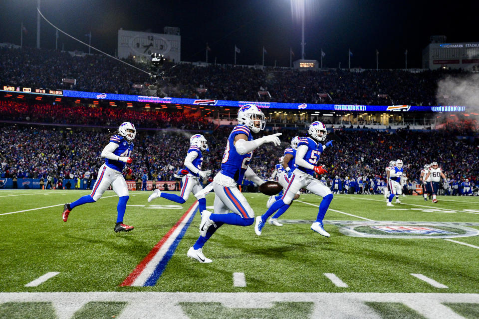 Buffalo Bills safety Micah Hyde, center, celebrates after catching an interception during the first half of an NFL wild-card playoff football game against the New England Patriots, Saturday, Jan. 15, 2022, in Orchard Park, N.Y. (AP Photo/Adrian Kraus)