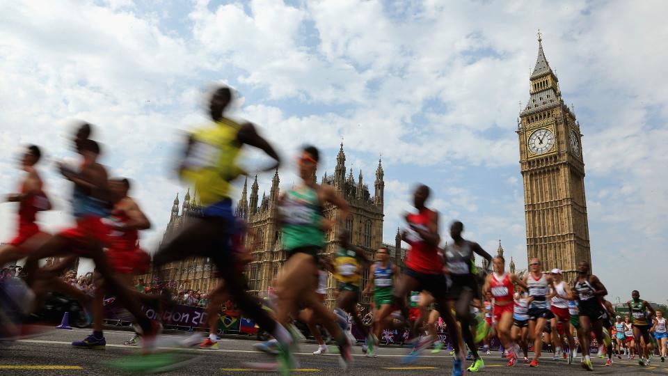 Athletes pass the Palace of Westminster as they compete in the Men's Marathon on Day 16 of the London 2012 Olympic Games on the streets of London on August 12, 2012 in London, England.