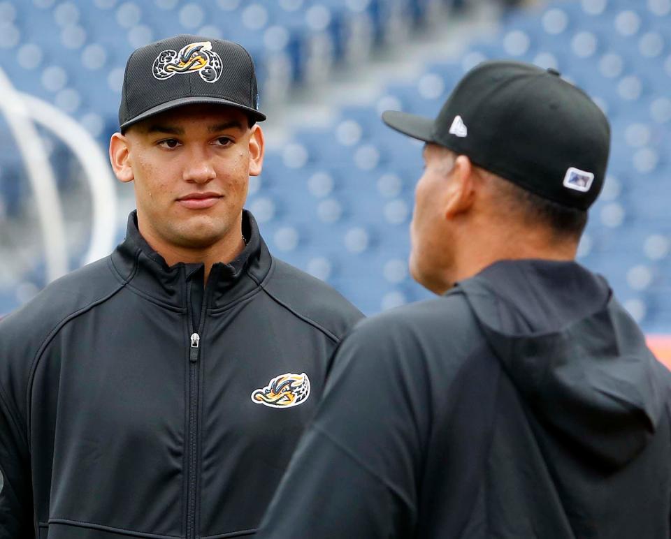 Cleveland Guardians top pitching prospect Daniel Espino, left, talks with Akron RubberDucks manager Rouglas Odor during the RubberDucks Media Day at Canal Park in Akron.