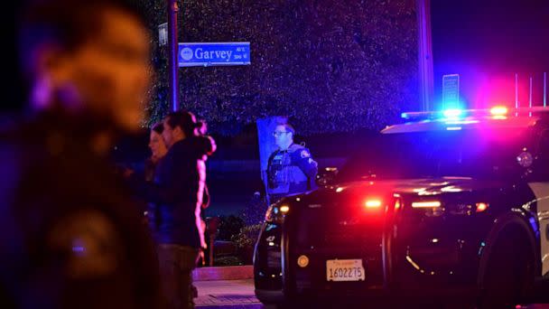 PHOTO: Police patrol the scene along Garvey Avenue in Monterey Park, California, on Jan. 21, 2023, where police are responding to reports of multiple people shot. (Frederic J. Brown/AFP via Getty Images)