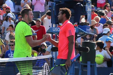 Sep 4, 2016; New York, NY, USA; Jack Sock of the United States (L) shakes hands with Jo-Wilfried Tsonga of France (R) after their match on day seven of the 2016 U.S. Open tennis tournament at USTA Billie Jean King National Tennis Center. Mandatory Credit: Anthony Gruppuso-USA TODAY Sports