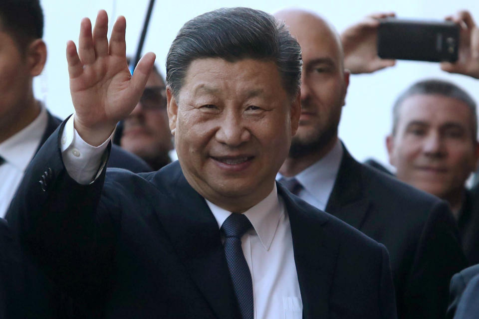 Chinese President Xi Jinping salutes upon arrival at the Royal Palace in Palermo, Sicily island, Italy, Saturday, March 23, 2019. (Igor Petyx/ANSA via AP)