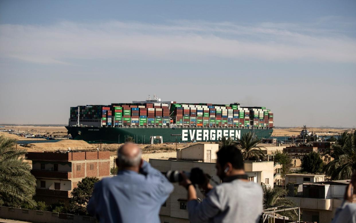 People watch as the container ship 'Ever Given' is refloated, unblocking the Suez Canal - Mahmoud Khaled/Getty Images Europe