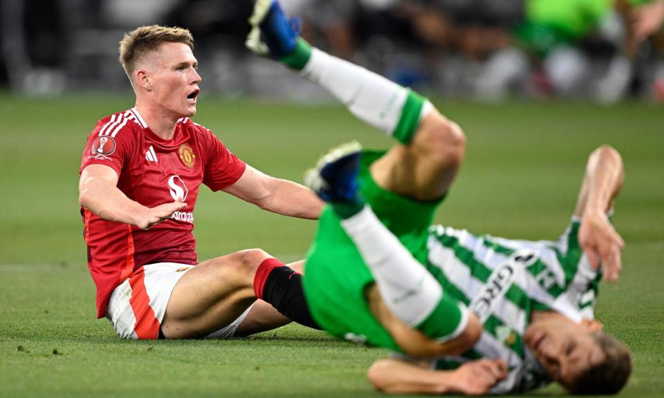 <span>Scott McTominay takes a seat as a Real Betis opponent goes tumbling after the Manchester United player’s shot in the US friendly.</span><span>Photograph: Orlando Ramirez/Getty Images</span>