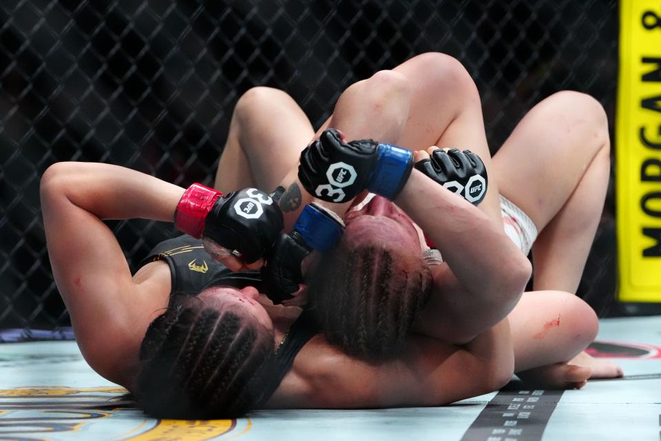 Sep 16, 2023; Las Vegas, Nevada, USA; Alexa Grasso (red gloves) fights Valentina Shevchenko (blue gloves) during UFC Fight Night at T-Mobile Arena. Mandatory Credit: Stephen R. Sylvanie-USA TODAY Sports