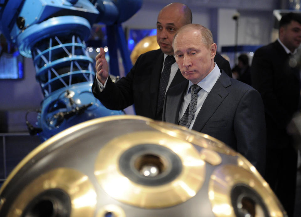 Russian Prime Minister Vladimir Putin, front, visits Moscow's Planetarium in Moscow, Thursday, April 12, 2012. Putin chaired a meeting with officials on building a new space launchpad in Russia's far east that should become operational by 2018. (AP Photo/RIA-Novosti, Alexei Druzhinin, Government Press Service)