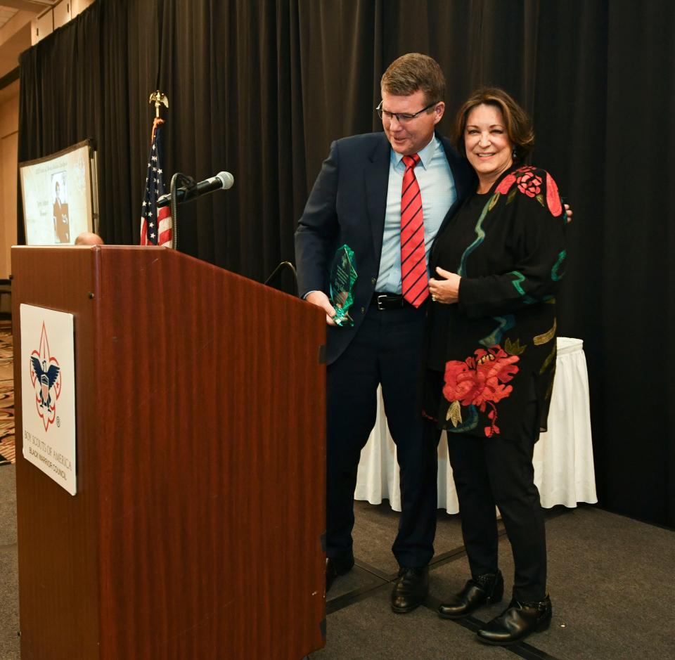 Mar 24, 2023; Tuscaloosa, AL, USA;  The Black Warrior Council of the Boy Scouts of America inducted Terry Saban into the Circle of Honor for her work in the Tuscaloosa community in a ceremony Friday at Embassy Suites. Tuscaloosa Mayor Walt Maddox presents the award to Saban.