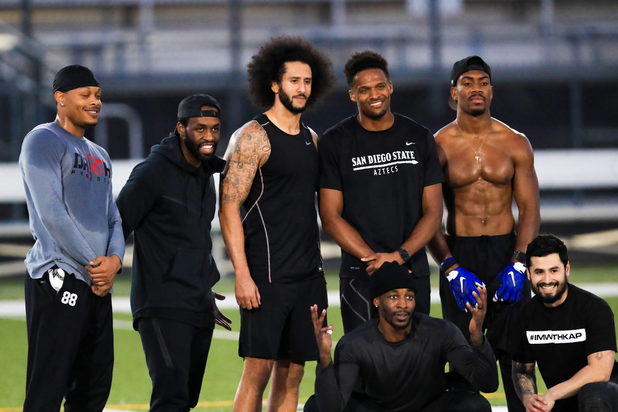 Colin Kaepernick stands with Bruce Ellington, Brice Butler, Jordan Veasy, and Ari Werts during the Kaepernick's NFL workout held at Charles R. Drew High School on November 16, 2019 in Riverdale, Georgia. (Photo by Carmen Mandato/Getty Images)