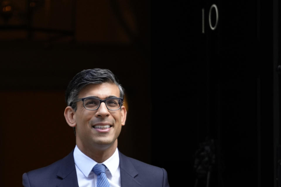 Britain's Prime Minister Rishi Sunak leaves 10 Downing Street to attend the weekly Prime Ministers' Questions session in parliament in London, Wednesday, March 22, 2023. (AP Photo/Kirsty Wigglesworth)