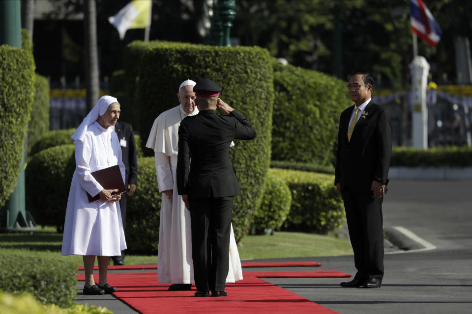 Pope Francis accompanied by his cousin Ana Rosa Sivori arrives for a welcome ceremony at the Government House courtyard, Thursday, Nov. 21, 2019, in Bangkok, Thailand. (AP Photo/Gregorio Borgia)