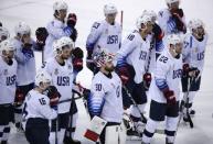 Ice Hockey - Pyeongchang 2018 Winter Olympics - Men's Quarterfinal Match - Czech Republic v U.S. - Gangneung Hockey Centre, Gangneung, South Korea - February 21, 2018 - U.S. players stand together after their loss in a shootout. REUTERS/Brian Snyder