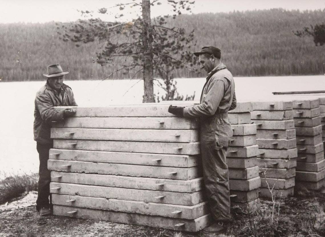 Glen Smith and Marc Obenchain work at Sandy Beach at Redfish Lake in 1960.