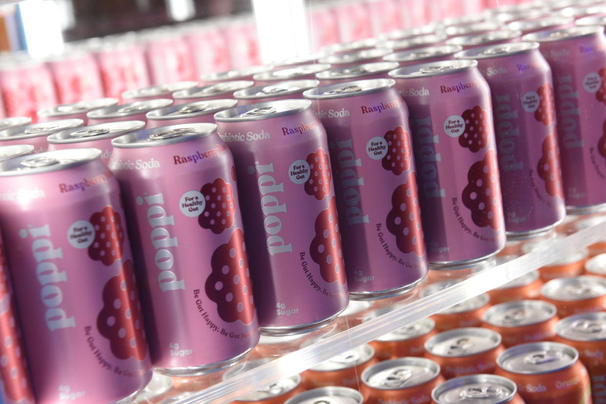 Cans of Poppi prebiotic soda on a shelf. 