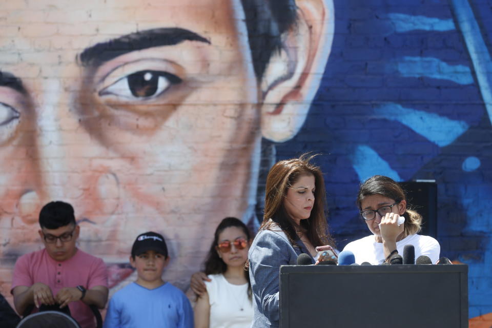 Esmaraldo Toledo, 24, right, sister of police shooting victim 13-year-old Adam Toledo sheds tears as family attorney Adeena Weiss-Ortiz speaks comforts her during a press conference announcing the opening of Adam's Place Inc., a not-for profit organization aiming to help at-risk youth from Chicago and other Midwestern cities to remain out of trouble, Wednesday, May 26, 2021 in Chicago's West Side. (AP Photo/Shafkat Anowar)