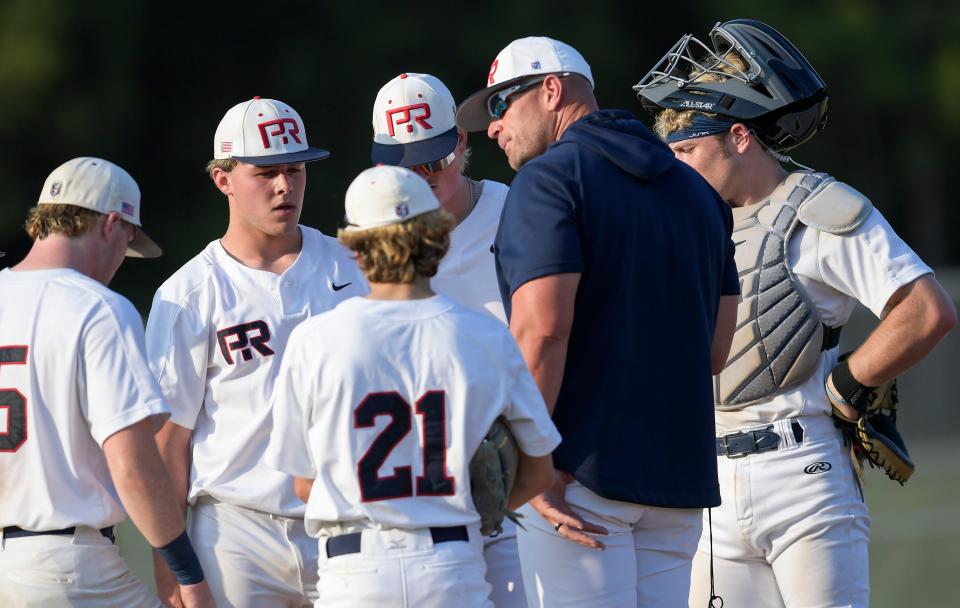 Pike Road coach Allen Ponder works with his team against McAdory during the first round of the AHSAA Baseball Playoffs at the Pike Road campus in Pike Road, Ala., on Friday April 19, 2024.