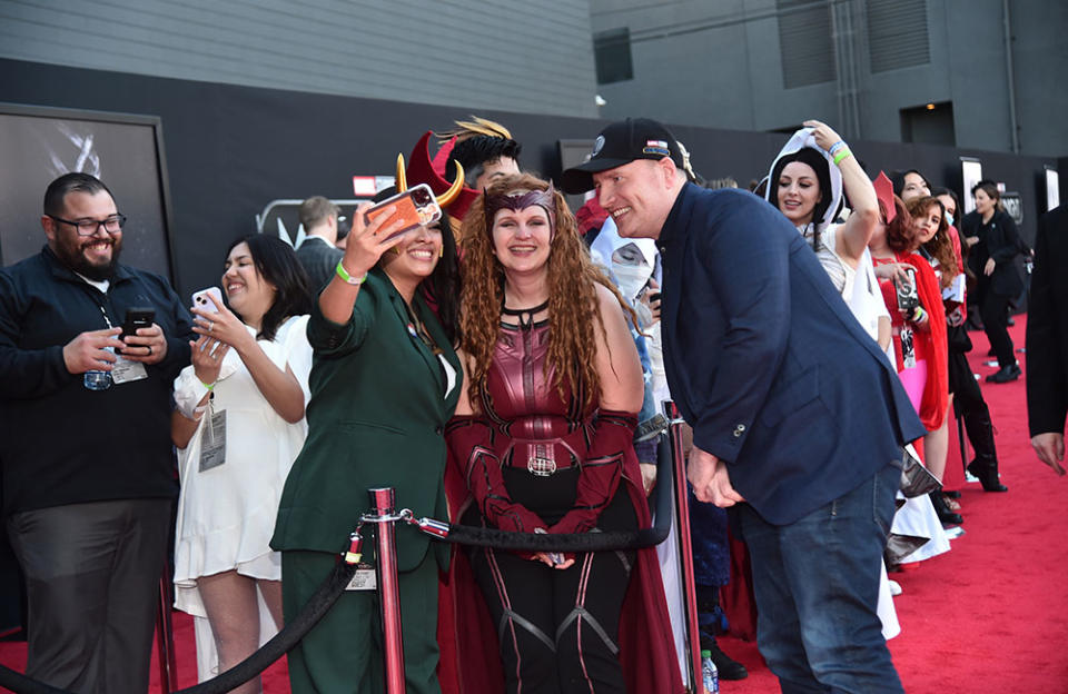 Kevin Feige (right), executive producer, Marvel Studios president and Marvel chief creative officer, poses with actors during the Moon Knight Los Angeles Special Launch Event at the El Capitan Theatre in Hollywood on March 22, 2022. - Credit: Alberto E. Rodriguez/Getty Images