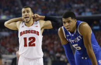 Wisconsin guard Traevon Jackson (12)and Kentucky guard Andrew Harrison (5) pause between plays during the second half of the NCAA Final Four tournament college basketball semifinal game Saturday, April 5, 2014, in Arlington, Texas. (AP Photo/David J. Phillip)