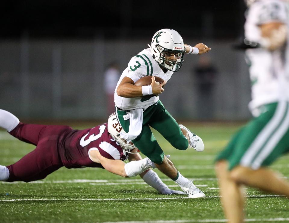 Archmere's Miles Kempski (3) tries to elude Caravel linebacker Brock Rhoades on Sept. 29 at Caravel.