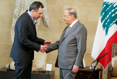 Lebanese President Michel Aoun meets with freed Lebanese businessman Nizar Zakka, who had been detained in Iran since 2015, at the presidential palace in Baabda