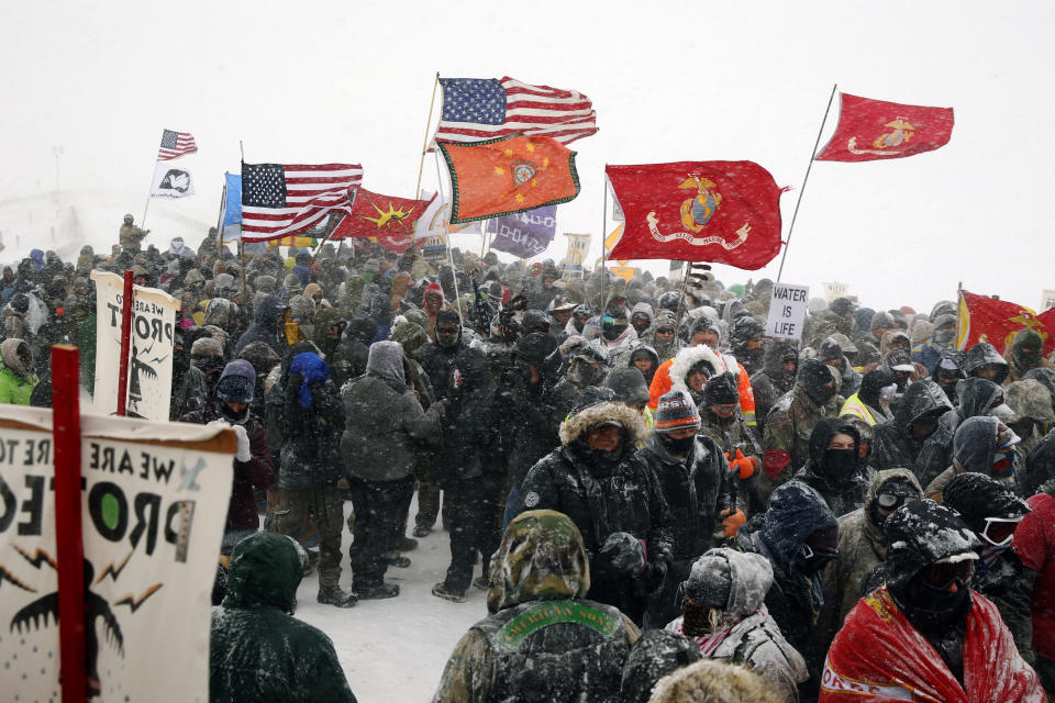 Veterans march with activists near Backwater Bridge.