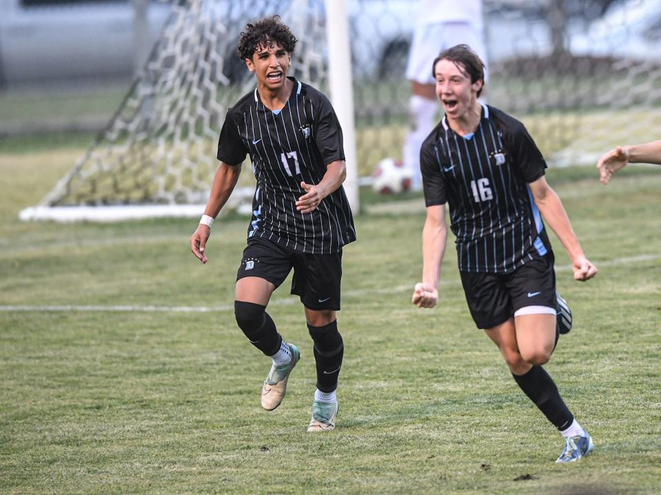 DW Daniel High forward Rayan Al-Nasser (17) celebrates when teammate fullback Owen Huey (16) scored during the first half of the Boy's 3A State Playoff soccer game at D.W. Daniel High School in Central, S.C. Monday, May 6, 2024.