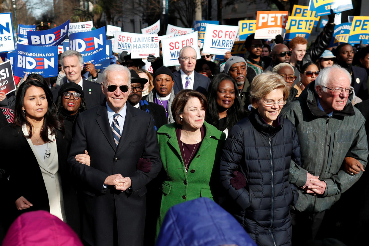 Democratic 2020 presidential candidates, including, from left, Rep. Tulsi Gabbard, then former Vice President Joe Biden, Sen. Amy Klobuchar, Sen. Elizabeth Warren and Sen. Bernie Sanders