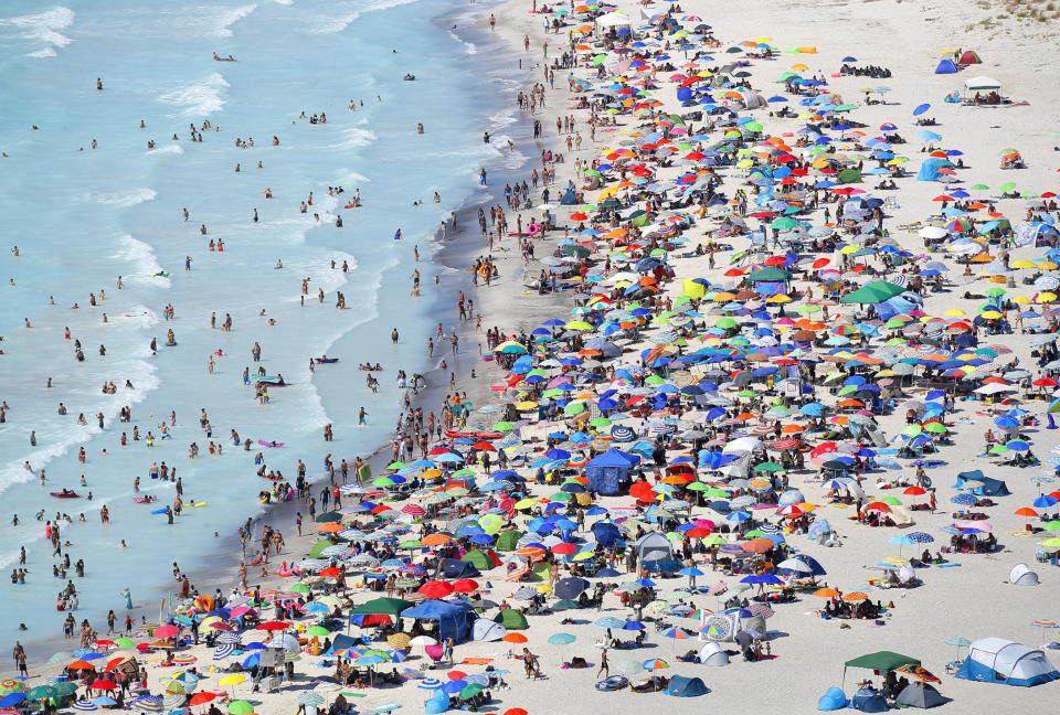 An aerial view taken from the HH412C helicopter 'Volpe 220' of the Pisa Air Section of the Guardia di Finanza of vacationers on the so-called 'White Beaches', in Rosignano Solvay, Tuscany region.Source: EPA