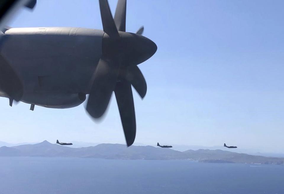 In this photo provided by the Greek Defense Ministry, military planes take part in a Greek-US military exercise near Athens, on Friday, Sept. 11, 2020. Prime Minister Kyriakos Mitsotakis was to outline the details of a program Saturday to boost Greece's defense capabilities, amid heightened tensions with neighboring Turkey over rights to resources in the eastern Mediterranean. (Greek Defense Ministry via AP)