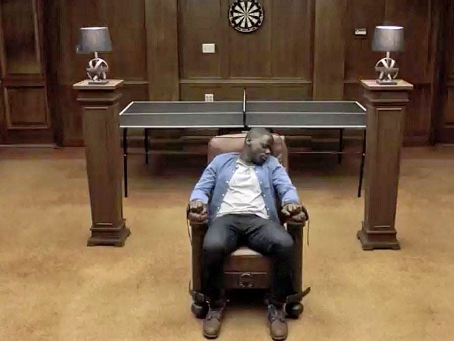 main character from "Get Out" tied to a chair and passed out