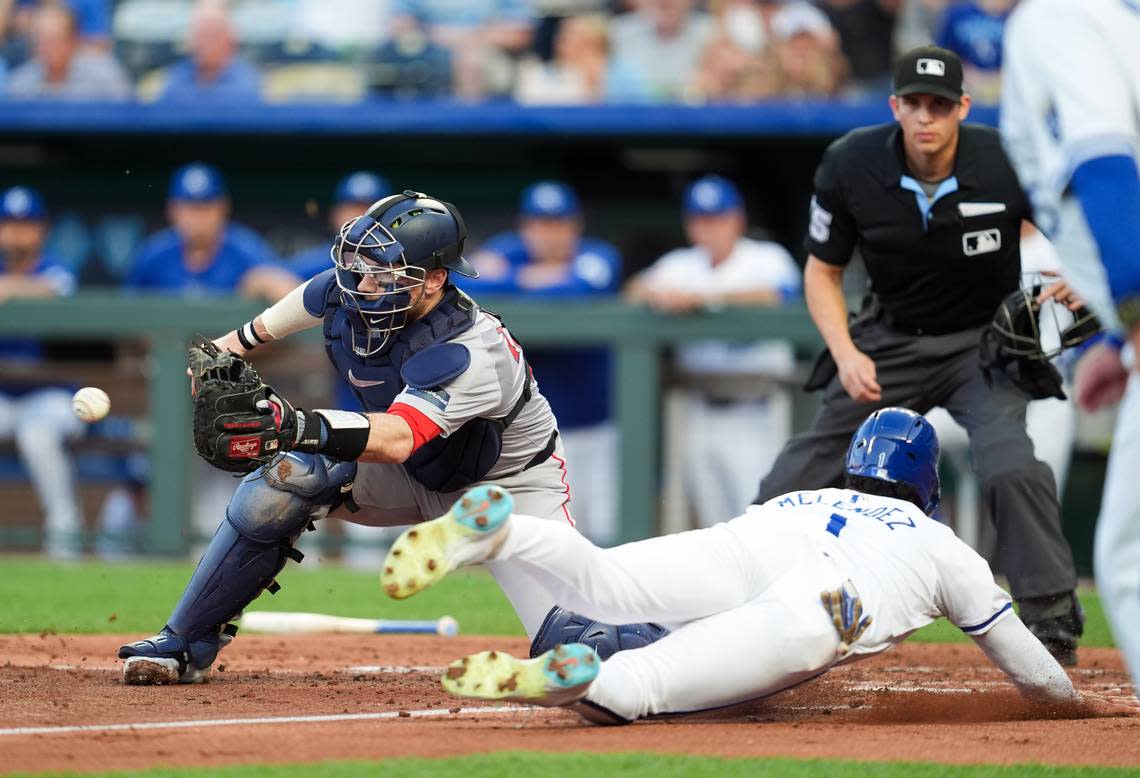 Kansas City Royals left fielder MJ Melendez (1) scores a run against Boston Red Sox catcher Danny Jansen (28) during the second inning at Kauffman Stadium on Aug. 7, 2024.