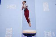 Sarah Voss, of Germany, performs on the vault during the women's artistic gymnastic qualifications at the 2020 Summer Olympics, Sunday, July 25, 2021, in Tokyo. (AP Photo/Gregory Bull)